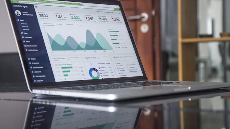 Comparison of multiple project management tools on a desktop workspace